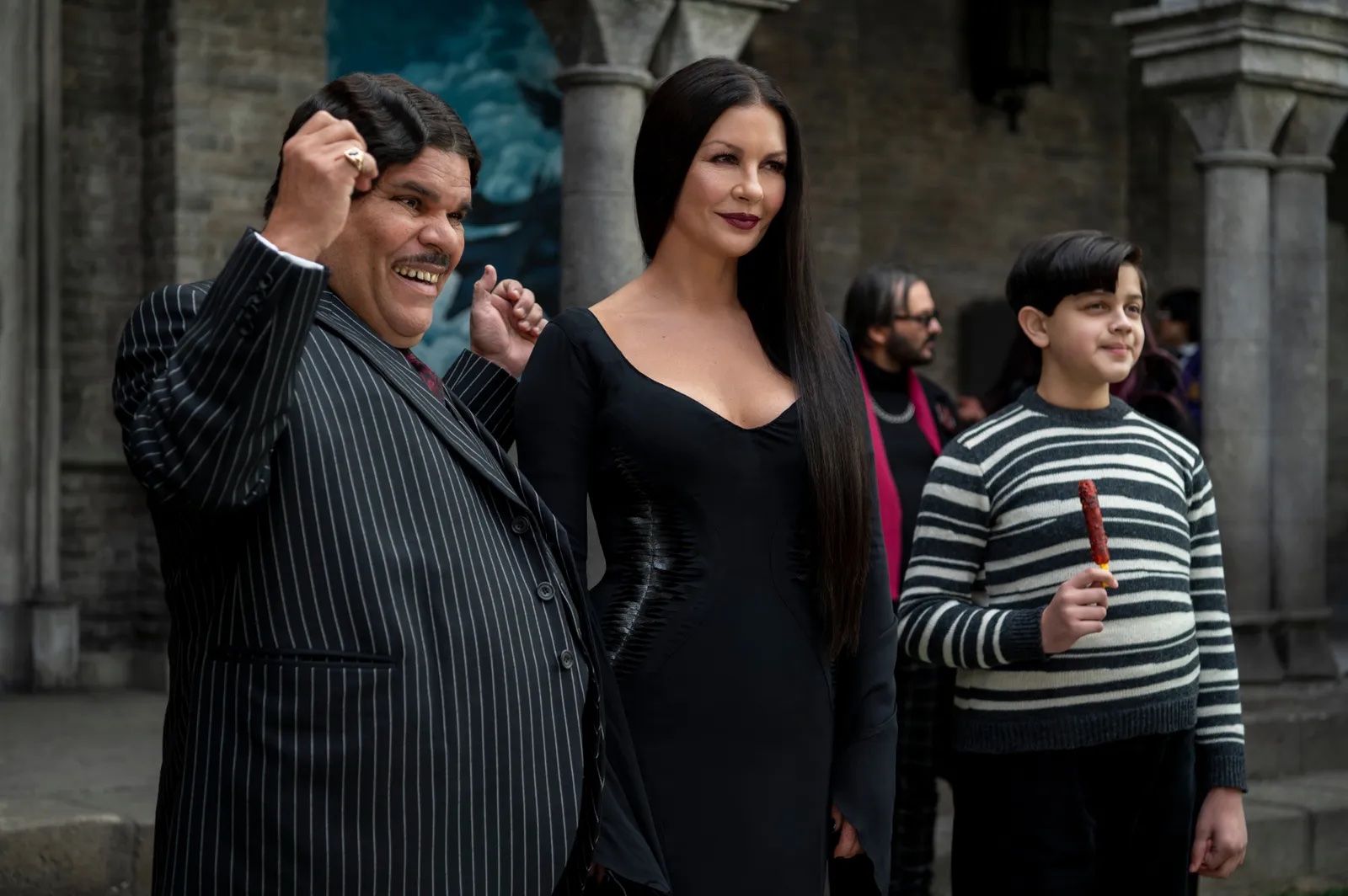 Catherine Zeta-Jones, Luis Guzmán, and Isaac Ordonez in Wednesday (2022)