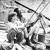 Elijah Wood and Courtney B. Vance in The Adventures of Huck Finn (1993)