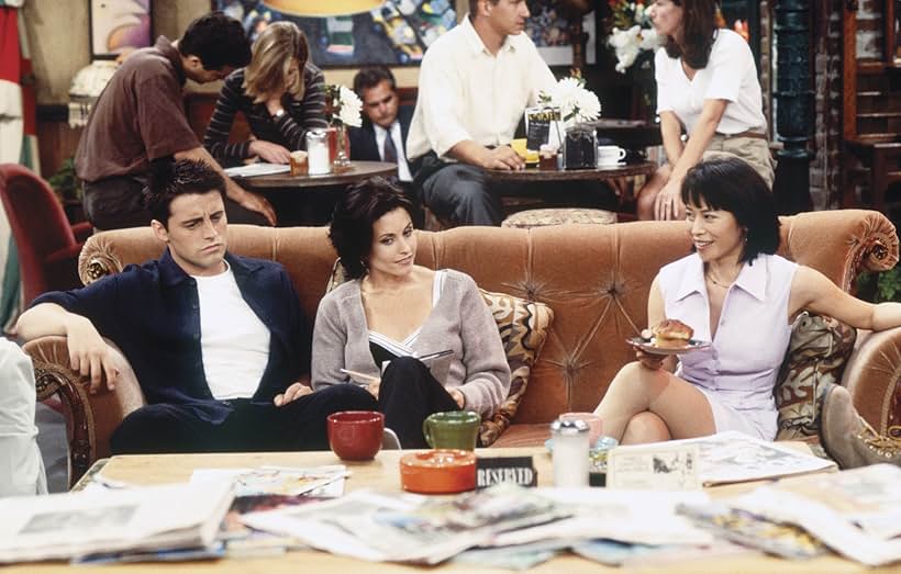 Courteney Cox, Matt LeBlanc, and Lauren Tom in Friends (1994)