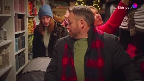 Frustrated man, Christmas shopping in a cramped store with 40 eager ladies