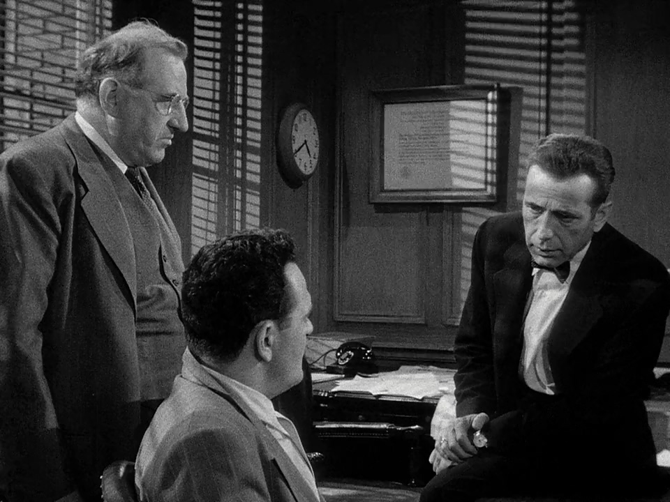 Humphrey Bogart, Ed Begley, and Joe De Santis in Deadline - U.S.A. (1952)