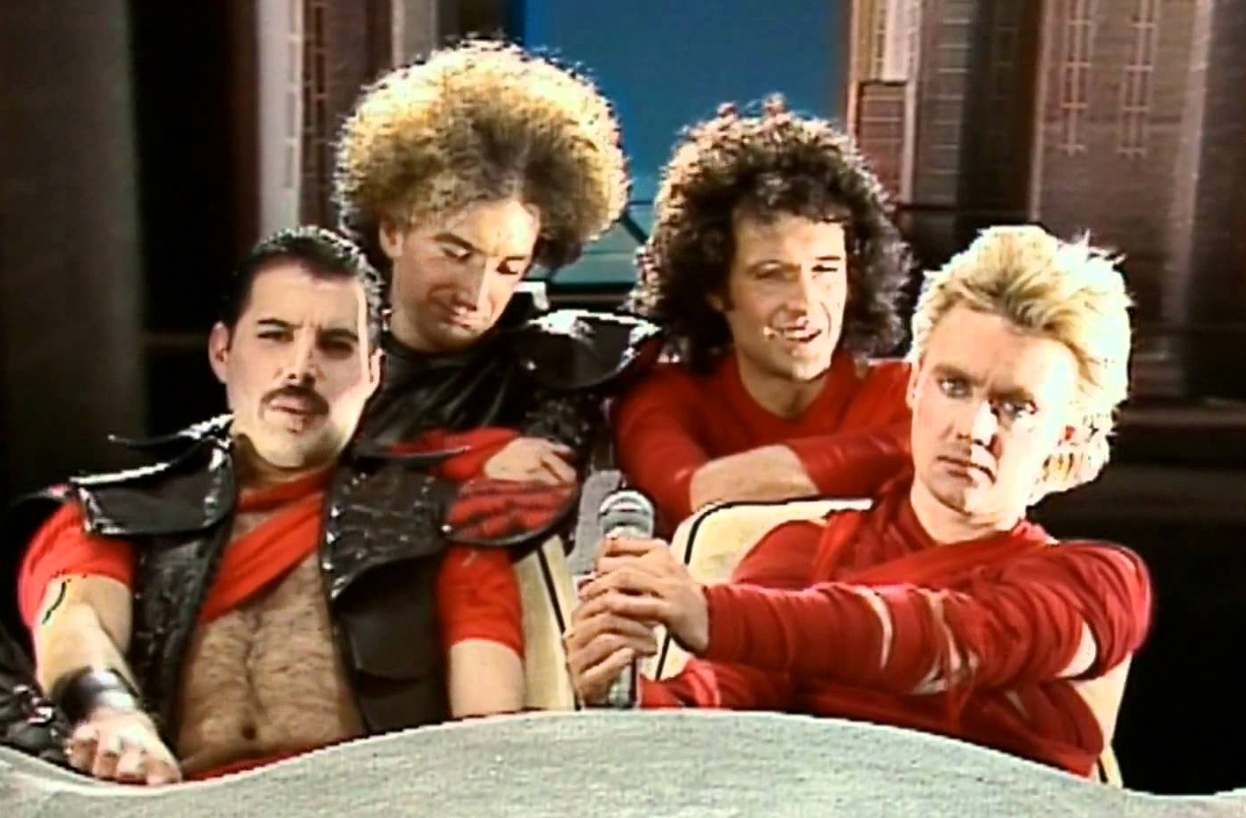 Roger Taylor, Brian May, Freddie Mercury, John Deacon, and Queen in Queen: Radio Ga Ga (1984)