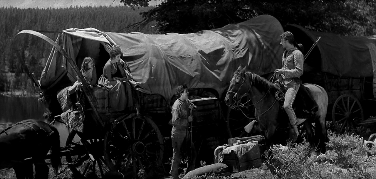 John Wayne, Marguerite Churchill, Helen Parrish, and David Rollins in The Big Trail (1930)