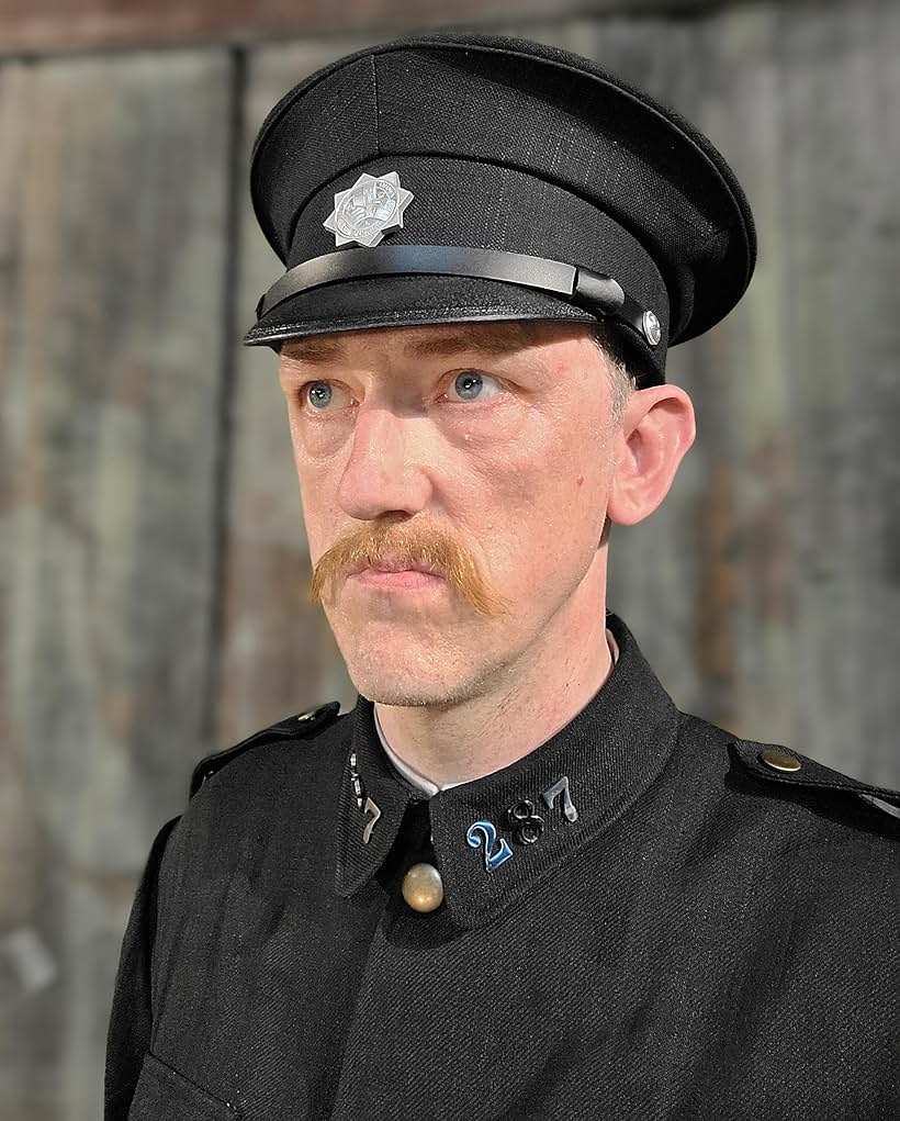 AJ Donnelly as Officer Nielsen in 'Burning Star' (2022)