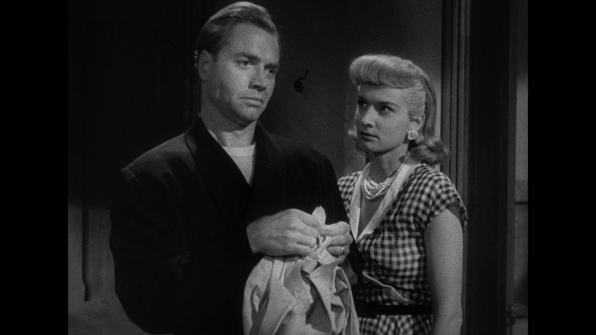 Lyle Bettger and Carole Mathews in No Man of Her Own (1950)