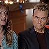 Robin Dunne and Erica Durance in The Enchanted Christmas Cake (2021)