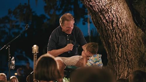 "The Gregg Russell Story" showcases the legacy of a man who has dedicated his life in the entertainment and care for thousands of families through his performances and humanitarian generosity. After working as a street musician at Disney World, Gregg Russell was invited to pick up his guitar and perform a show in Hilton Head, South Carolina, under a 300-year-old oak tree. Forty-seven years later, you can still find him there, strumming his guitar and bringing laughter and song to generations of families.