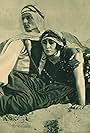 Stacia Napierkowska and Jacques de Trévières in Inch'Allah (1922)