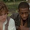 Elijah Wood and Courtney B. Vance in The Adventures of Huck Finn (1993)