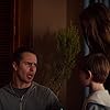 Sam Rockwell, Saxon Sharbino, and Kyle Catlett in Poltergeist (2015)