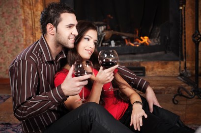 Happy couple near fireplace