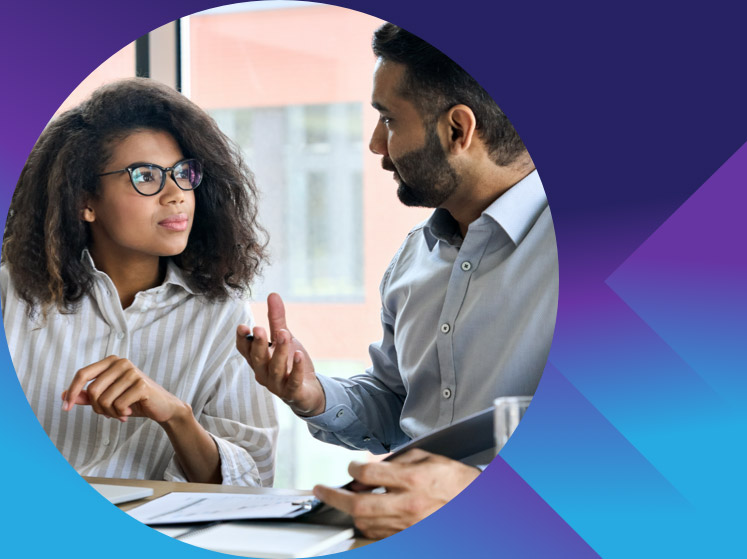 man and women talking over paperwork