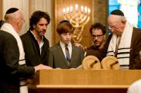 A SERIOUS MAN, director Joel Coen (left of center), Aaron Wolff (center), director Ethan Coen (right of center), on set, 2009. ph: Wilson Webb/©Focus Features