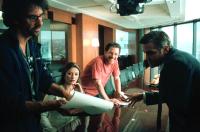 INTOLERABLE CRUELTY, Director Joel Coen, Catherine Zeta-Jones, screenwriter Ethan Coen, George Clooney on the set, 2003, (c) Universal