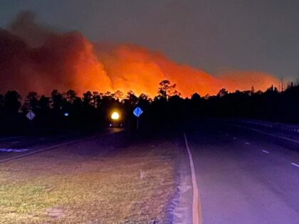 In this photo released by the Horry County Fire Rescue, smoke is seen from fires in Horry