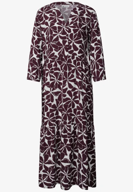 Midi-jurk met gespleten hals en print rustic rouge Lang bordeauxjurk met witte bladrandprint en V-hals.
