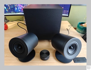 Two black coneshaped speakers angled upwards