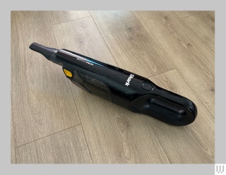 Shark Ultra Cyclone Pet Pro Plus a small black handheld vacuum on a wooden surface