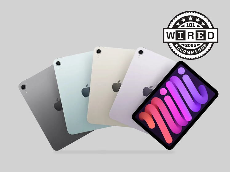 Five apple iPad Minis lined up together in different colors