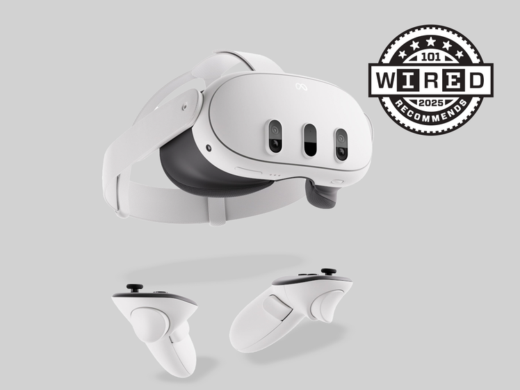 A WHITE VR HEADSET WITH TWO HAND CONTROLLERS