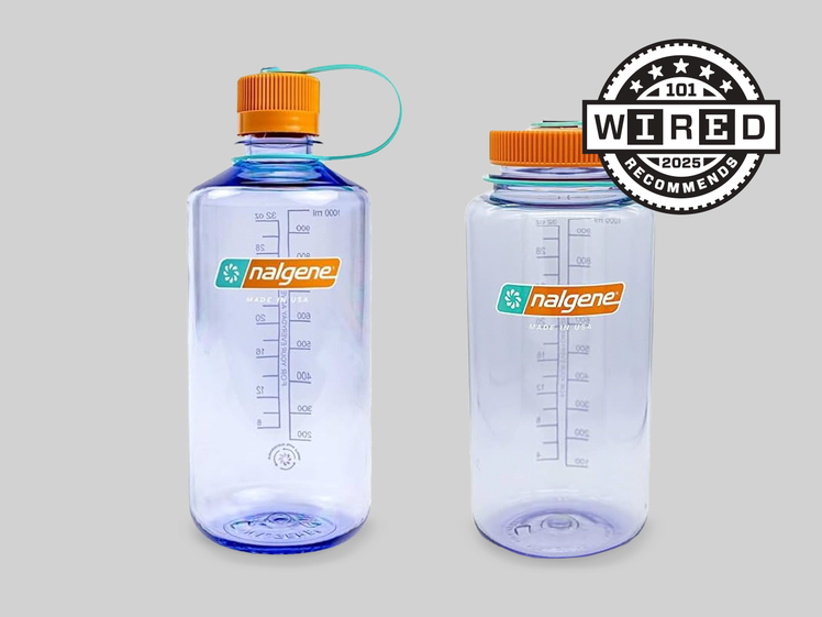 CLEAR PURPLE WATER BOTTLE WITH AN ORANGE CAP