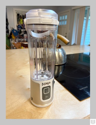 Ninja Blast Portable Blender a narrow cylindrical shaped clear container with an electronic base