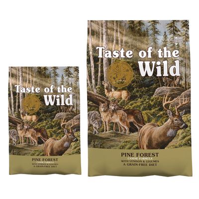 Taste of the Wild Pine Forest Canine Formula mit Wild und Hülsenfrüchten, getreidefreie Ernährung. Verpackung mit Waldmotiv und Tieren.