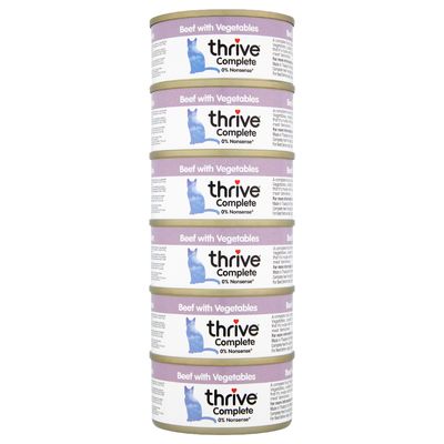 Stack of five tins labelled 'Beef with Vegetables', thrive Complete, 0% Nonsense. Each tin shows a blue animal silhouette and product details.