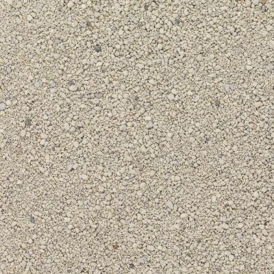Close-up of light beige cat litter with fine granules.
