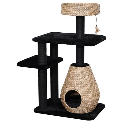 Cat tree with black plush, three levels, sisal posts, woven basket as a cave, and an upper lying area with toy hanger.