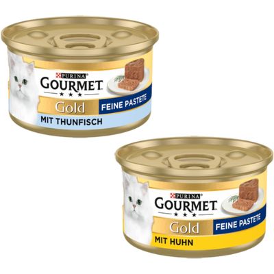 Purina Gourmet Gold paté fino con pollo, 48 latas. Se muestra: lata dorada con motivo de gato y trozo de paté en plato.