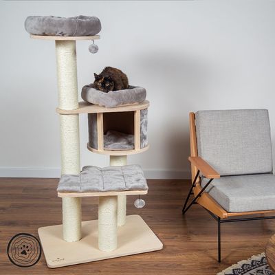 Cat tree with three levels, sisal posts and grey padded surfaces. Includes cave and resting areas. Cat lying on top level. Brand logo visible bottom left.
