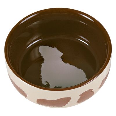Brown feeding bowl with dog silhouette inside and cowhide pattern outside.