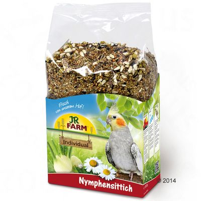 JR Farm Individual Nymphensittich, eleségkeverék kamillával és édesköménnyel, frissen a gazdaságból. A csomagoláson egy nimfapapagáj zöld háttér előtt látható.