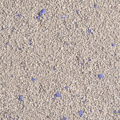 Close-up of cat litter with grey granules and blue particles.
