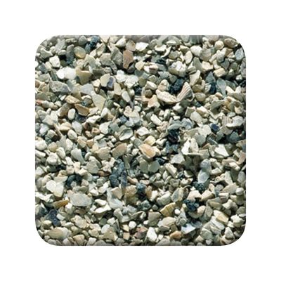 Primer plano de granos minerales de varios colores, adecuado para describir un material de lecho o sustrato.