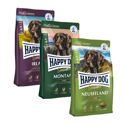 Tri pakiranja Happy Dog Sensible suhe hrane za pse, varijante Irland, Montana i Neuseeland, svako 11 kg. Na pakiranjima vidljiv pas i natpisi: Adult, Made in Germany.