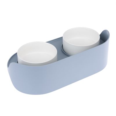 Doppelnapf-Set mit zwei weissen Keramikschalen in einer hellblauen Halterung, geeignet für Futter und Wasser.