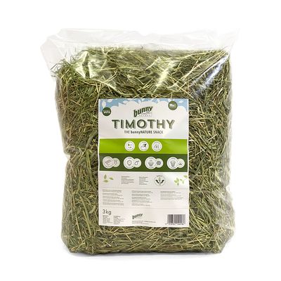 bunny Nature Timothy Heu, 3kg. Envase con iconos: 100% natural, fibra bruta óptima, sin aditivos, recomendado por veterinarios. Descripción y valores nutricionales visibles.