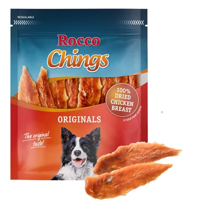 Rocco Chings Originals, 100% szárított csirkemell, visszazárható csomagolás. Képen: kutya és termék. Rocco Chings Originals, 100% szárított csirkemell, visszazárható csomagolás. Képen: kutya és termék.