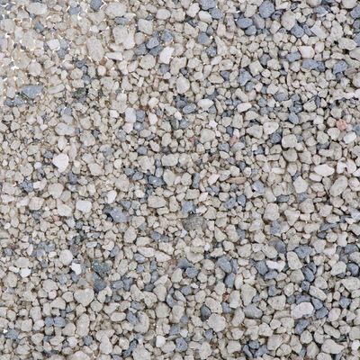 Close-up view of grey and white granules, showing the texture and size of the product material.