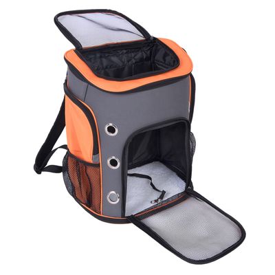 Mochila gris y naranja con ventanas de malla, orificios de ventilación de metal y bolsillos laterales. Adecuada para transportar mascotas.
