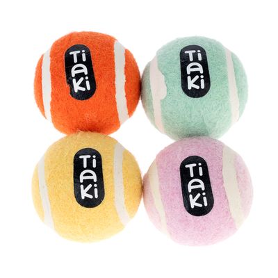 Cuatro pelotas de juego Tiaki en naranja, amarillo, verde y rosa con rayas blancas y logo Tiaki.