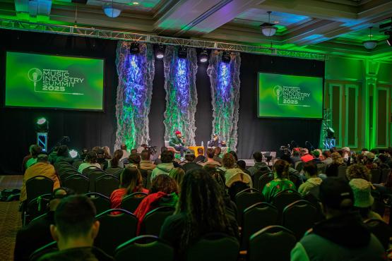  Attendants watch DJ Premier getting interview in Baker Ballroom at the 2025 Ohio University Music Industry Summit. 