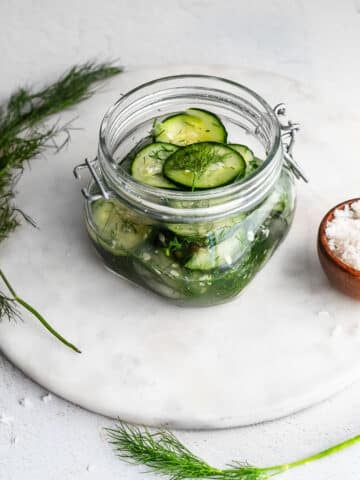 quick pickles in a jar garnished with dill