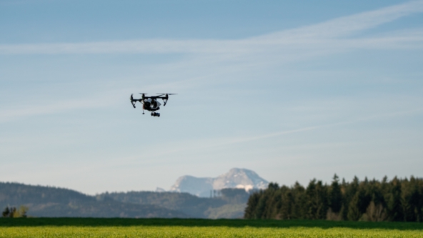 Drone flying over a field