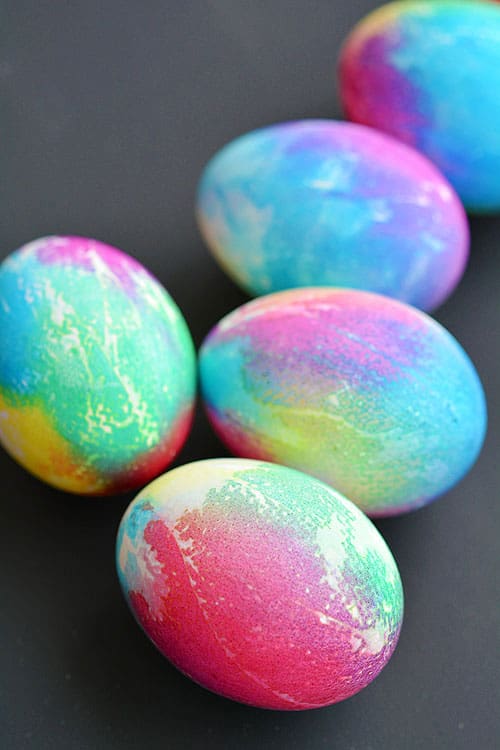 These tie dye Easter eggs are SO FUN and they're so simple to make! The colours are bright and beautiful and the eggs are completely safe to eat!
