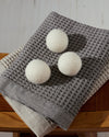 The ONSEN Wool Dryer Balls with packaging on a white background.