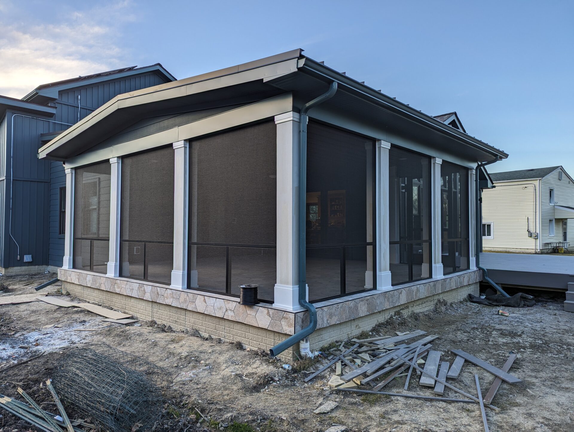L & N Builders, 225 S Pleasant St (1) Screening Solutions Ohio installs fixed permanent screening onto a covered porch in Ohio. The screen enclosure includes a custom transom for added strength and durability.