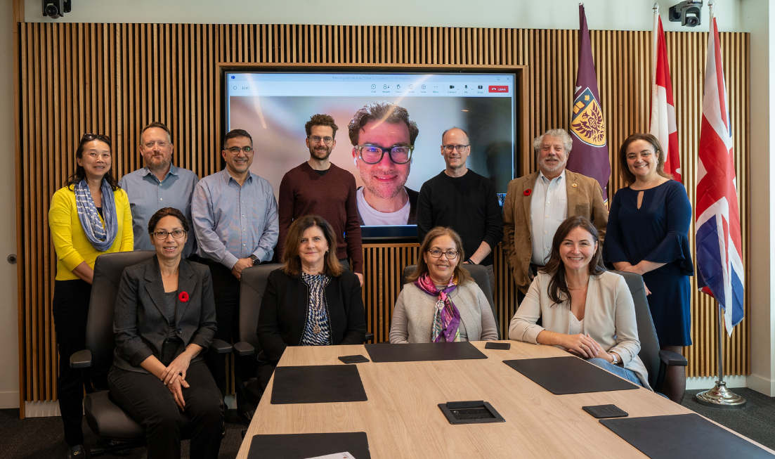 A group of people in a boardroom.